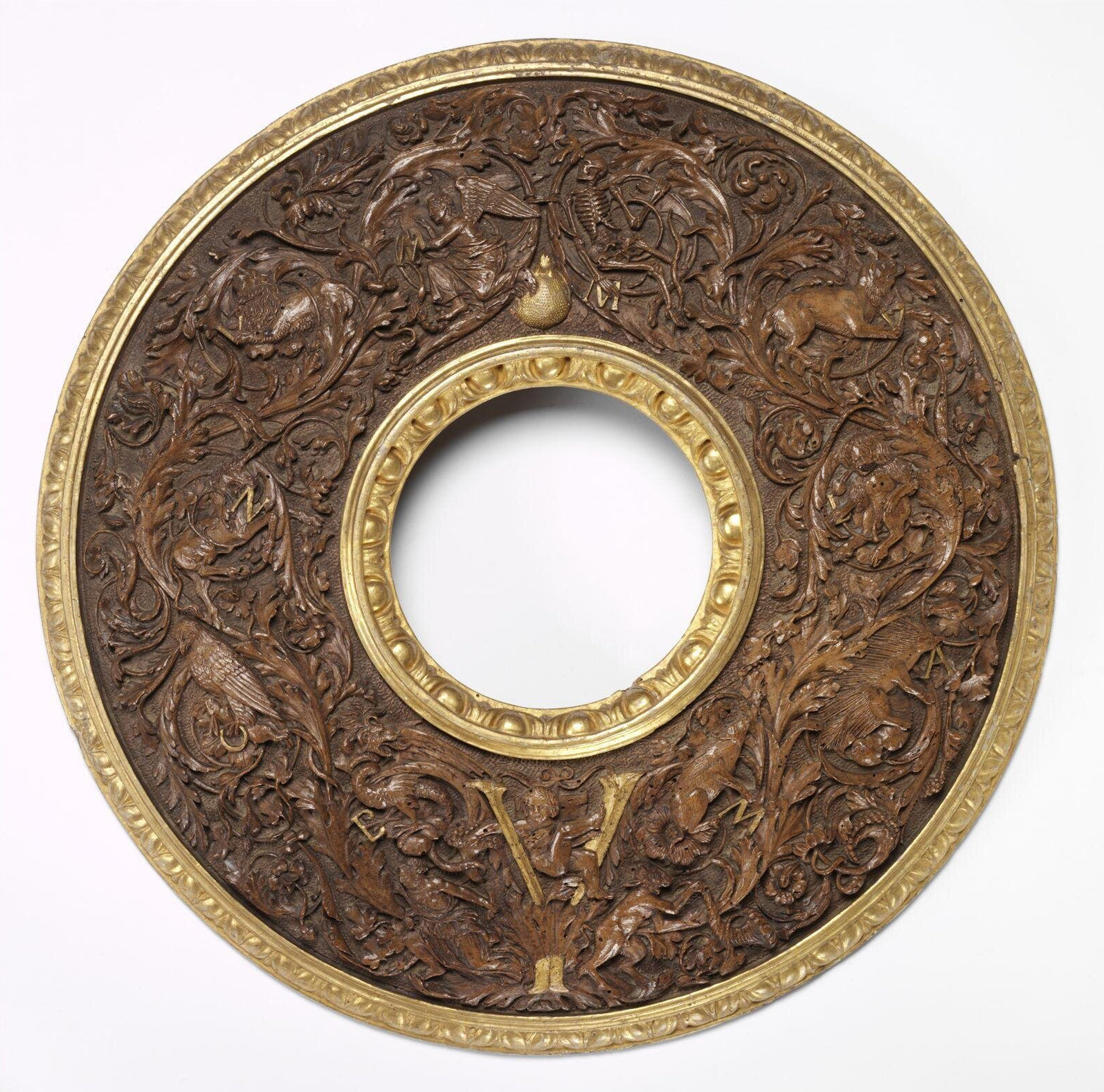 5 Ferrarese tondo looking glass frame c1490to1500 parcel gilt walnut 49cm diam V & A